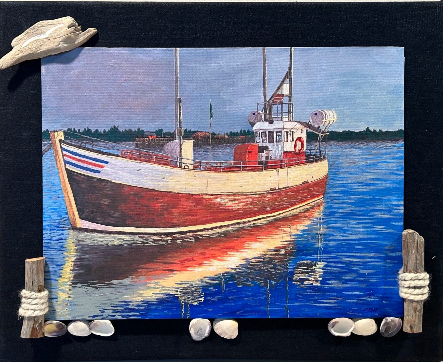 Painting of a boat on the water with a shoreline and cloudy sky in the background, surrounded by seashells and wooden posts with ropes on a denium frame. Can easily be reframed to your liking.