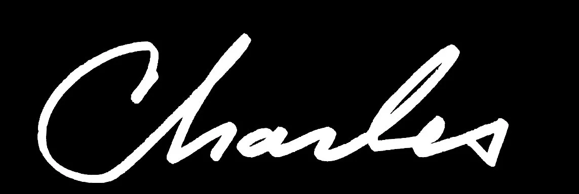 White signature reading 'Charles' on a black background