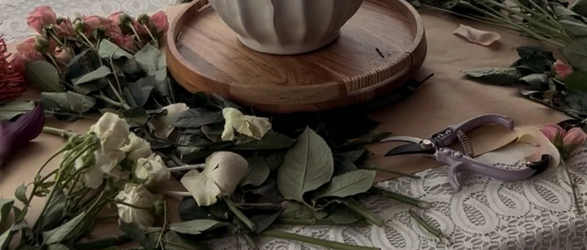 Floral design workspace with fresh flowers and clippers at Fable & Fig Florals in Denver