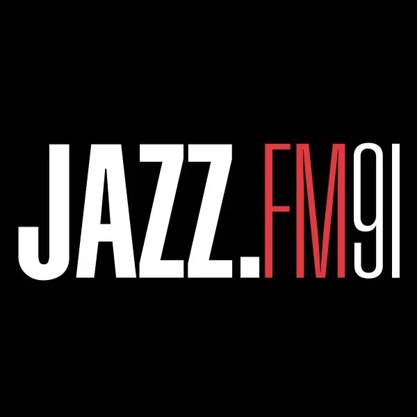 Logo for JAZZ FM 91 with black background, white 'JAZZ' text and red 'FM 91' text.
