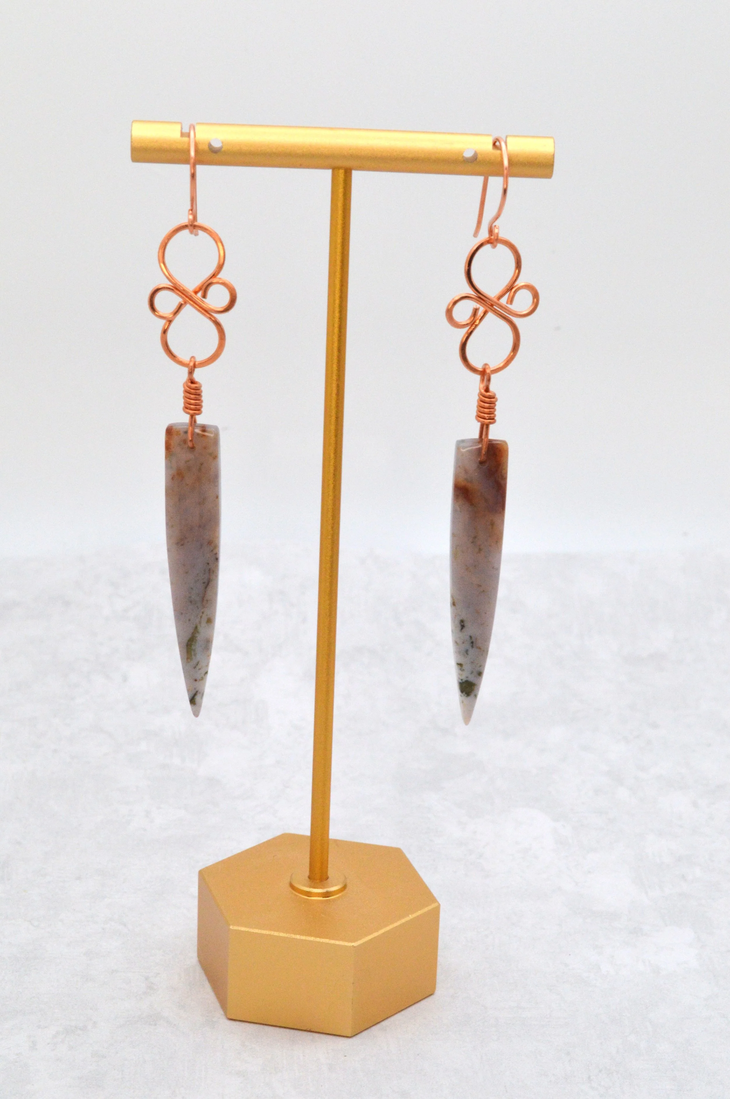 handmade ocean jasper copper wire wrapped dagger earrings with copper infinity knot connector
