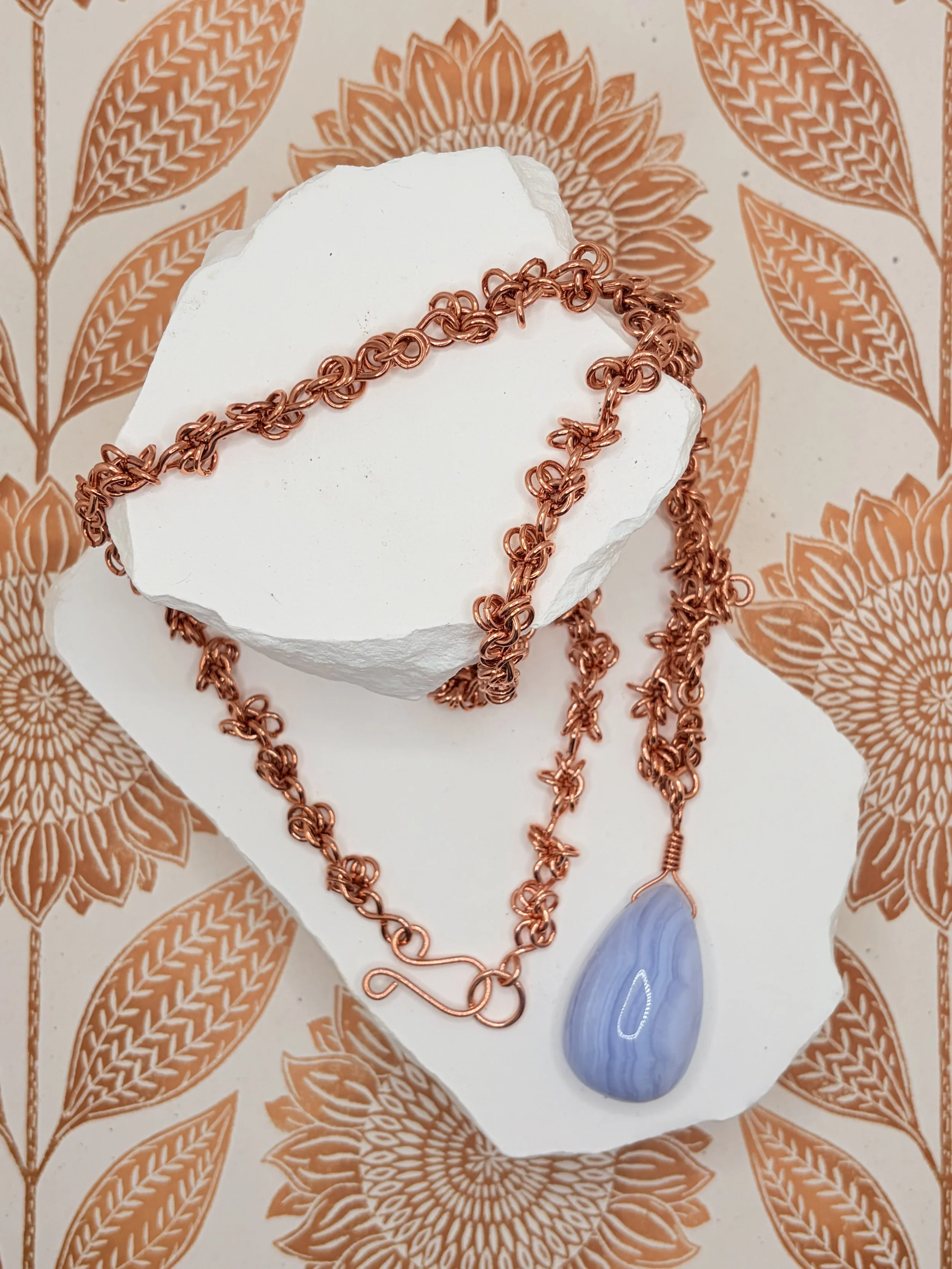 Copper chainmail necklace with a blue lace agate teardrop pendant
