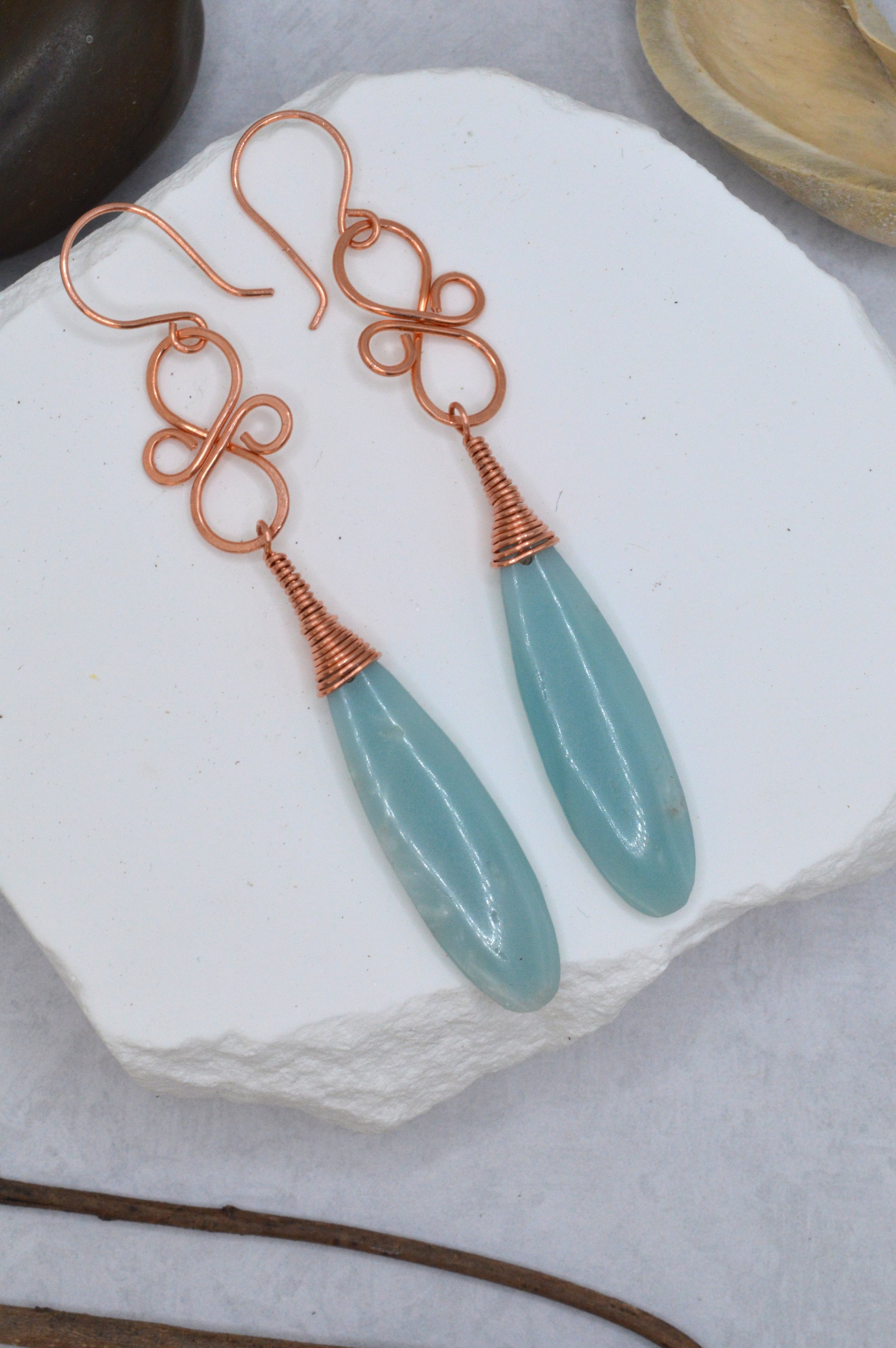 handmade calcite copper wire wrapped teardrop earrings with ornate copper knotwork link
