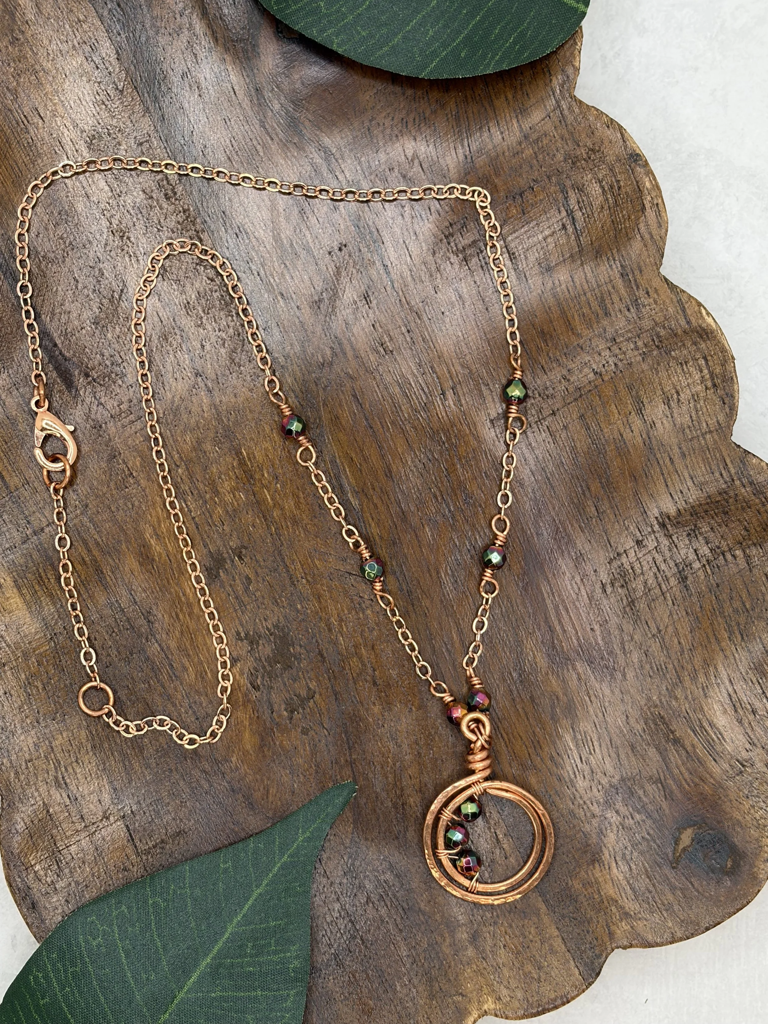 handmade copper chain necklace with hematite beads and hammered double loop pendant