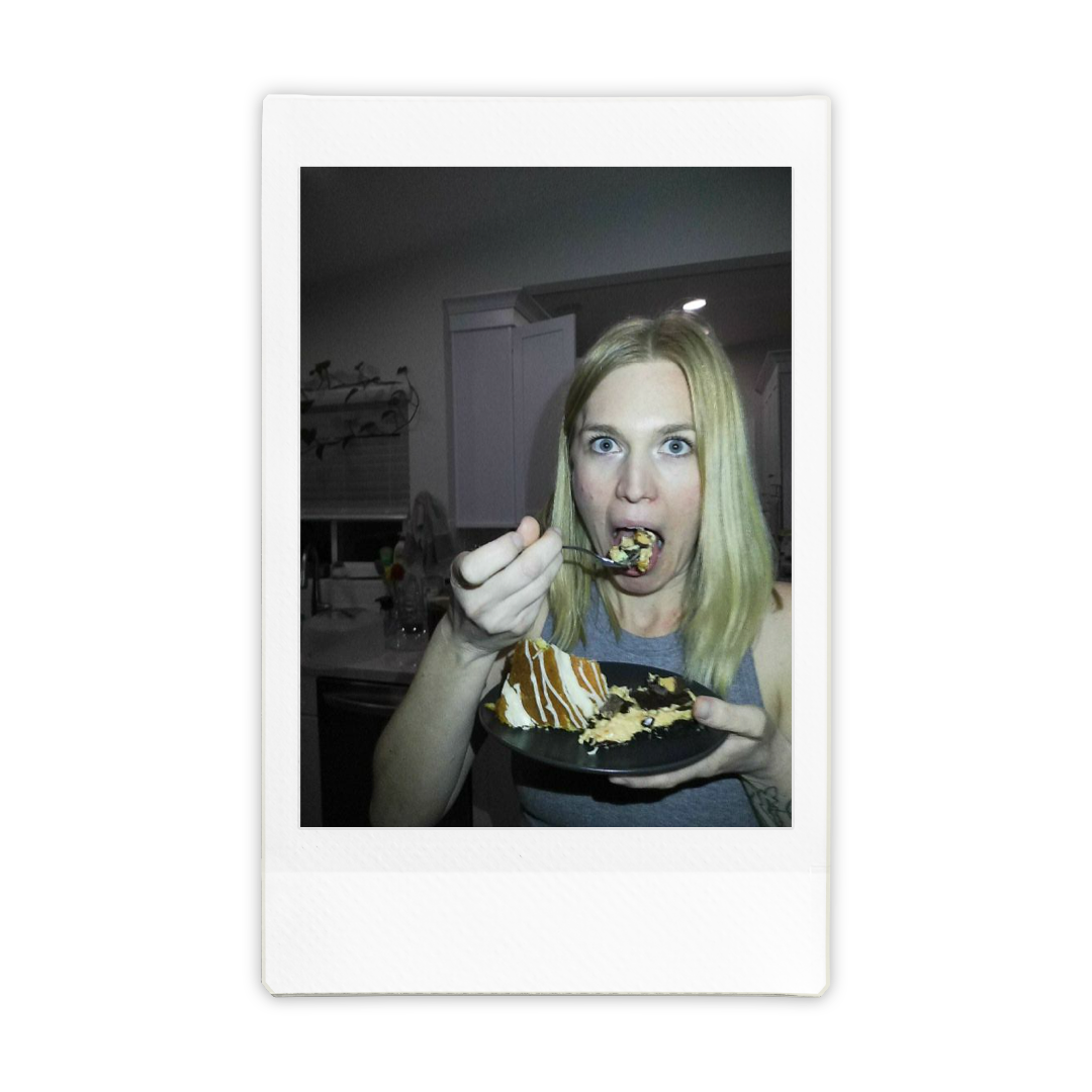 Lisa Williams eats a slice of cake with a fork at home.