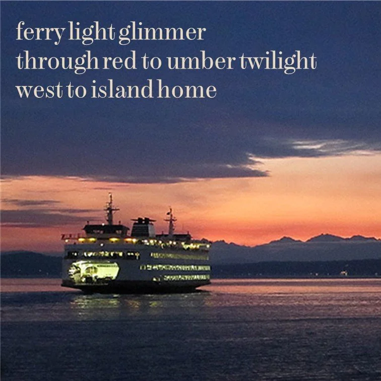 Ferry boat sailing at sunset with colorful sky and silhouetted mountains in the background.