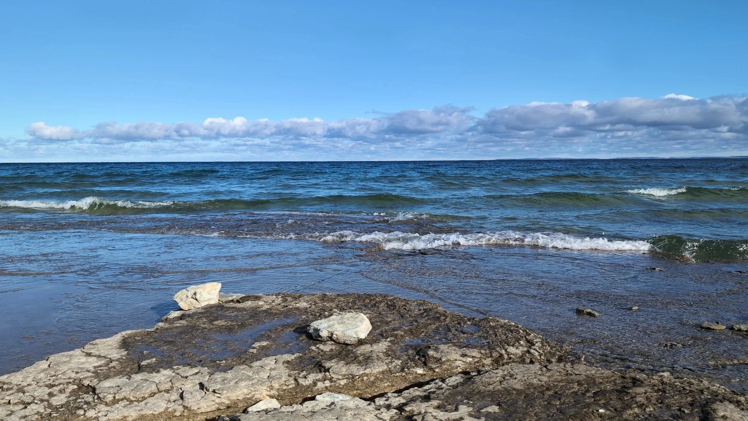 Blue sky and clouds over the open waters of Lake Huron in South Georgian Bay
