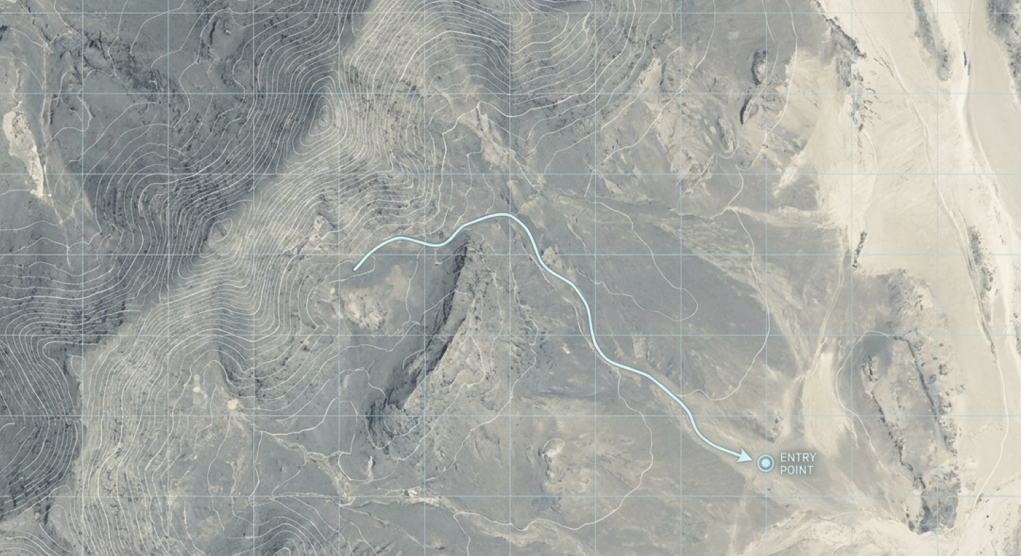 A topographic map with contour lines showing terrain elevation, a blue trail leading to an entry point marked with a circle and arrow.
