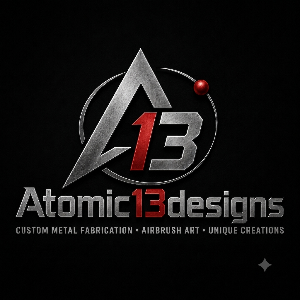 Logo for Atomic 13 Designs featuring a stylized A and 13 in metallic silver and red, with text highlighting custom metal fabrication, airbrush art, and unique creations.