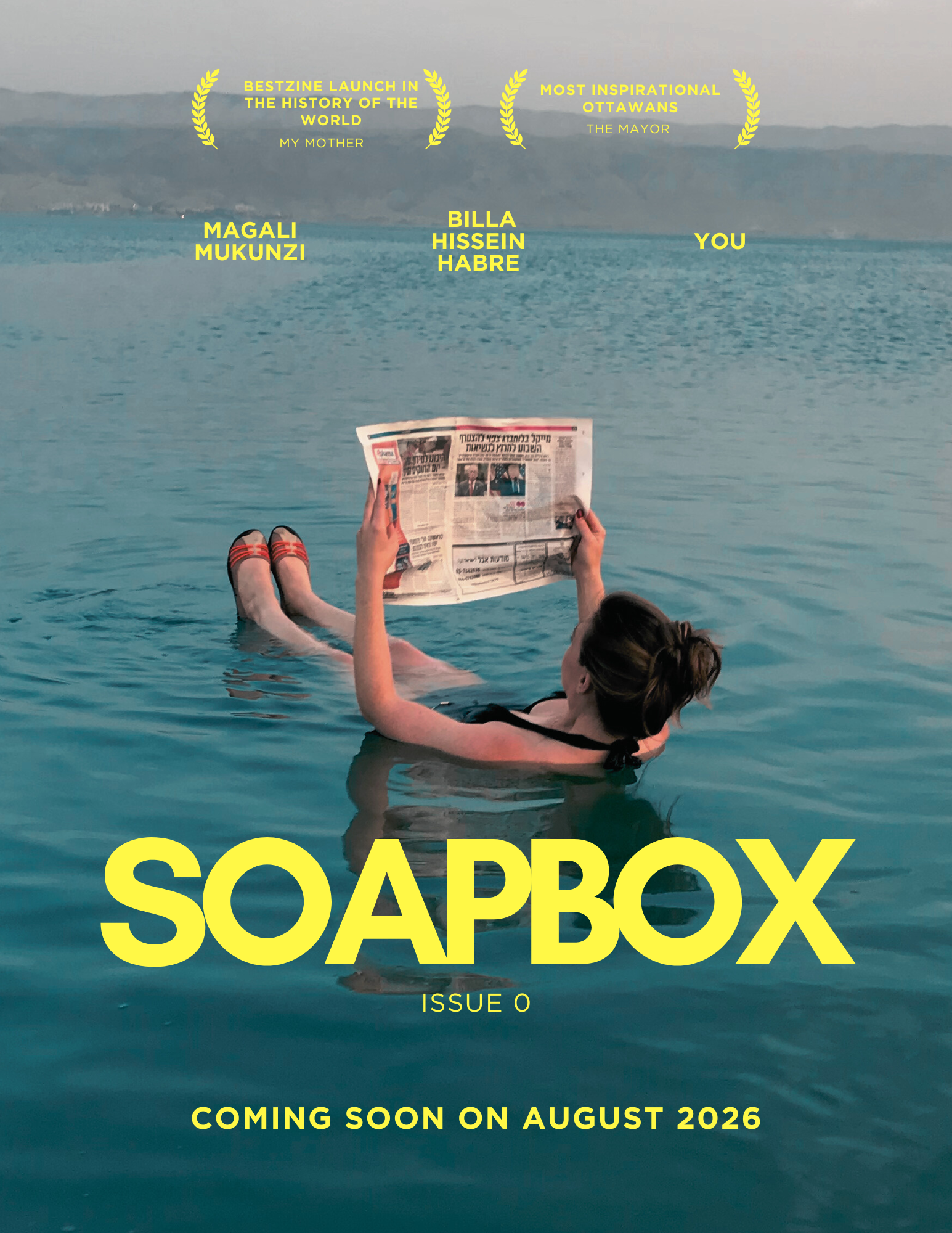 A person floating in a swimming pool, reading a newspaper, with mountains in the background. The magazine cover has yellow text that reads 'SOAPBOX,' 'ISSUE 0,' and 'COMING SOON ON AUGUST 2026,' with additional yellow text at the top highlighting awards and praise.