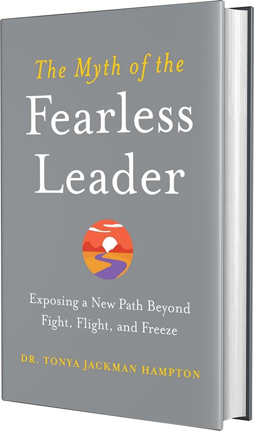 Book titled "The Myth of the Fearless Leader" by Dr. Tonya Jackman Hampton, with subtitle "Exposing a New Path Beyond Fight, Flight, and Freeze" and a cover illustration of a sunset over a landscape.