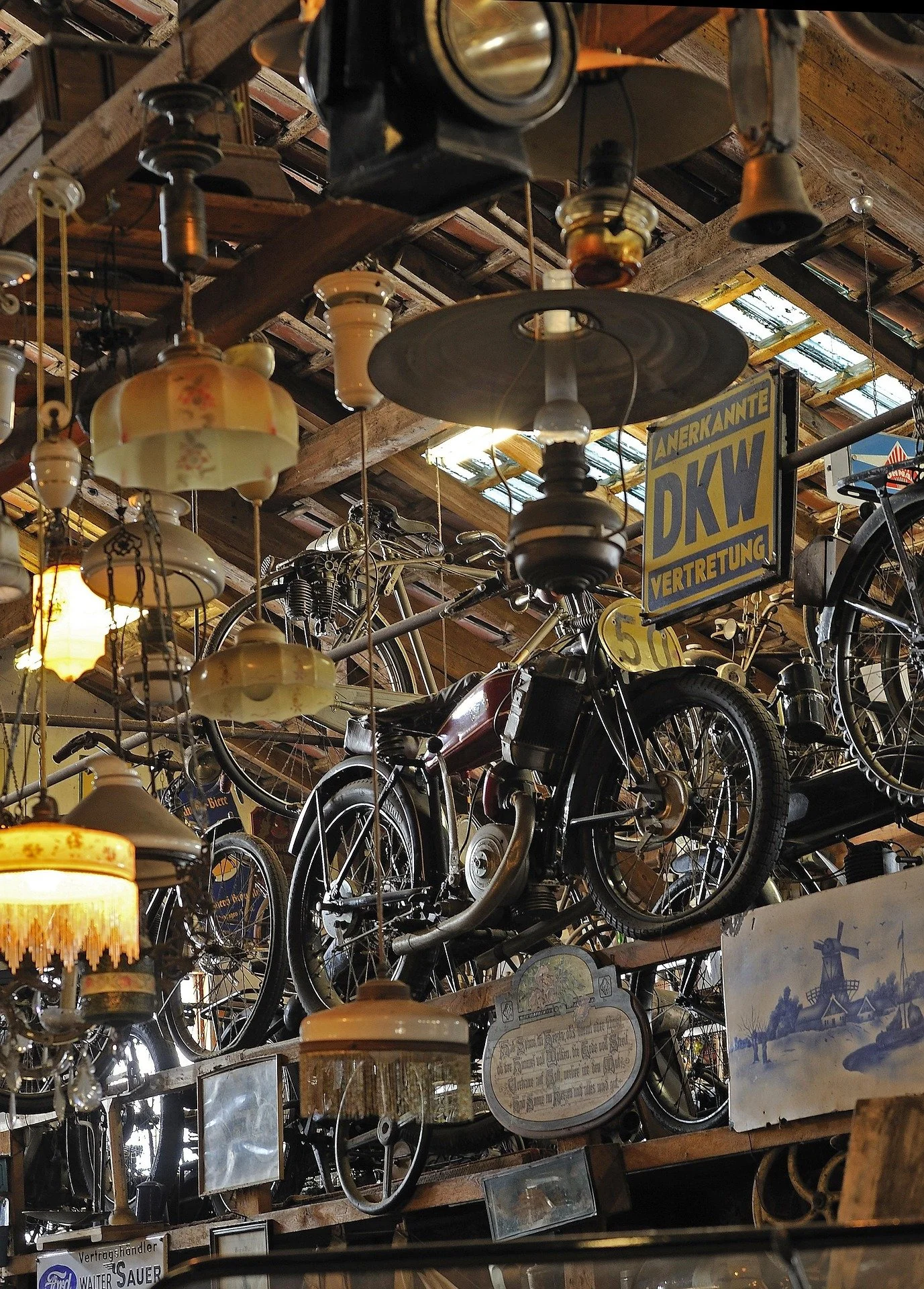 museum or store of antiques, bicycles, motorcycle, and lamps