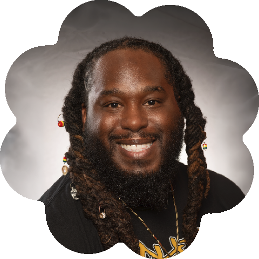 David O. Fakunle II, Assistant Professor at the Morgan State University School of Community Health & Policy, wearing a black t-shirt with a graphic.
