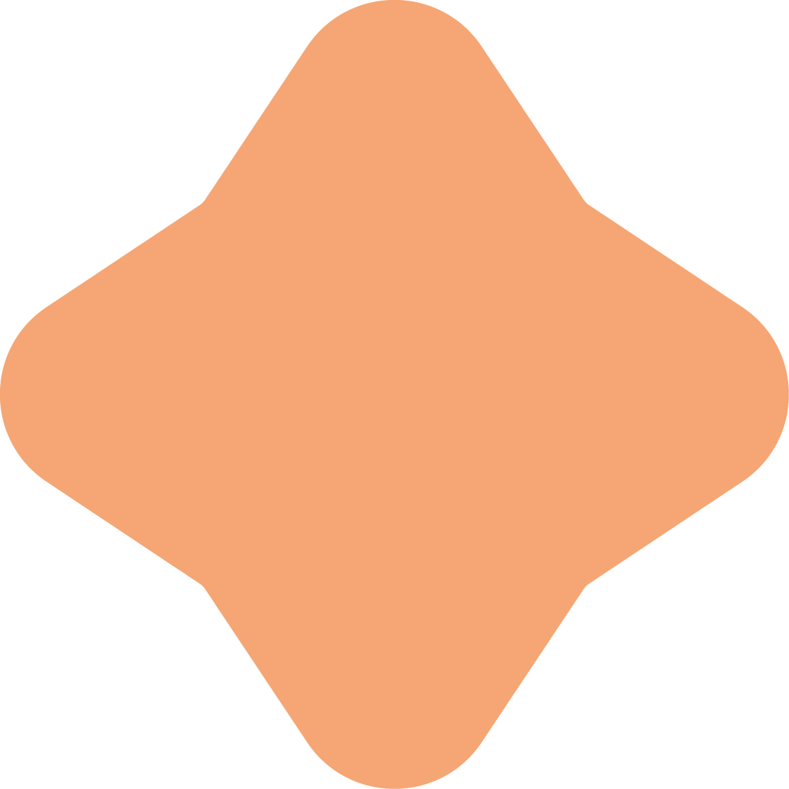 A peach-colored geometric shape with rounded edges, resembling a 3D diamond or rhombus.