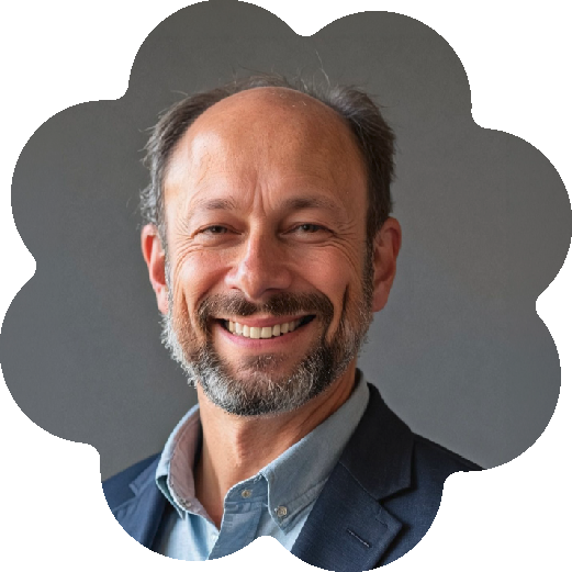 Dr. Alan Siegel, Executive Director & Co-founder of Social Prescribing USA, wearing a light blue shirt and dark blazer, against a gray background.