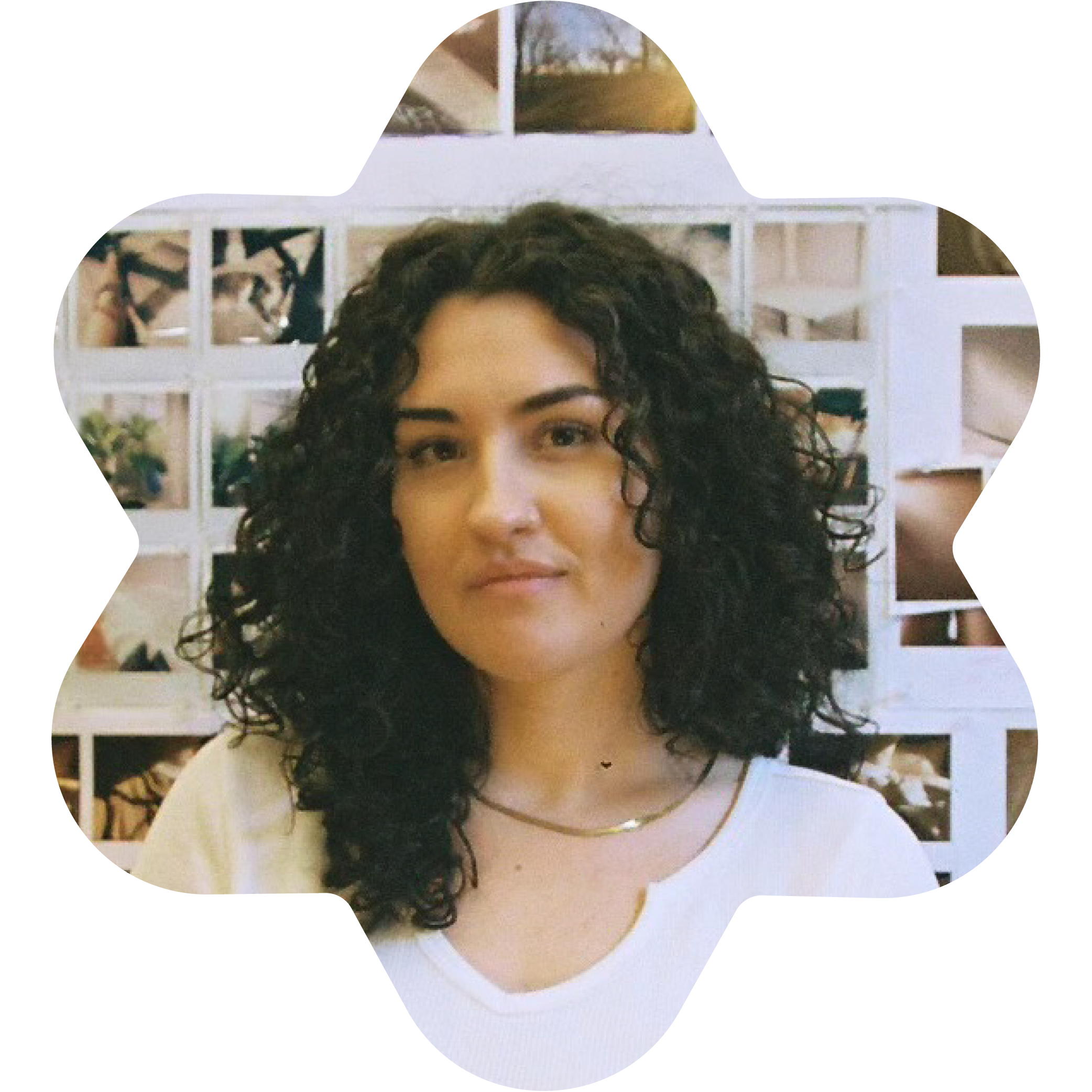 Rachel Herring, Creative Director and Artist at Studio Herring and Assistant Professor of Graphic Design at Rochester Institute of Technology, wearing a white shirt in a room with Polaroids in the background.
