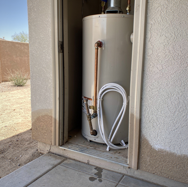 Three plumbing pipes galvanized copper PEX in wall