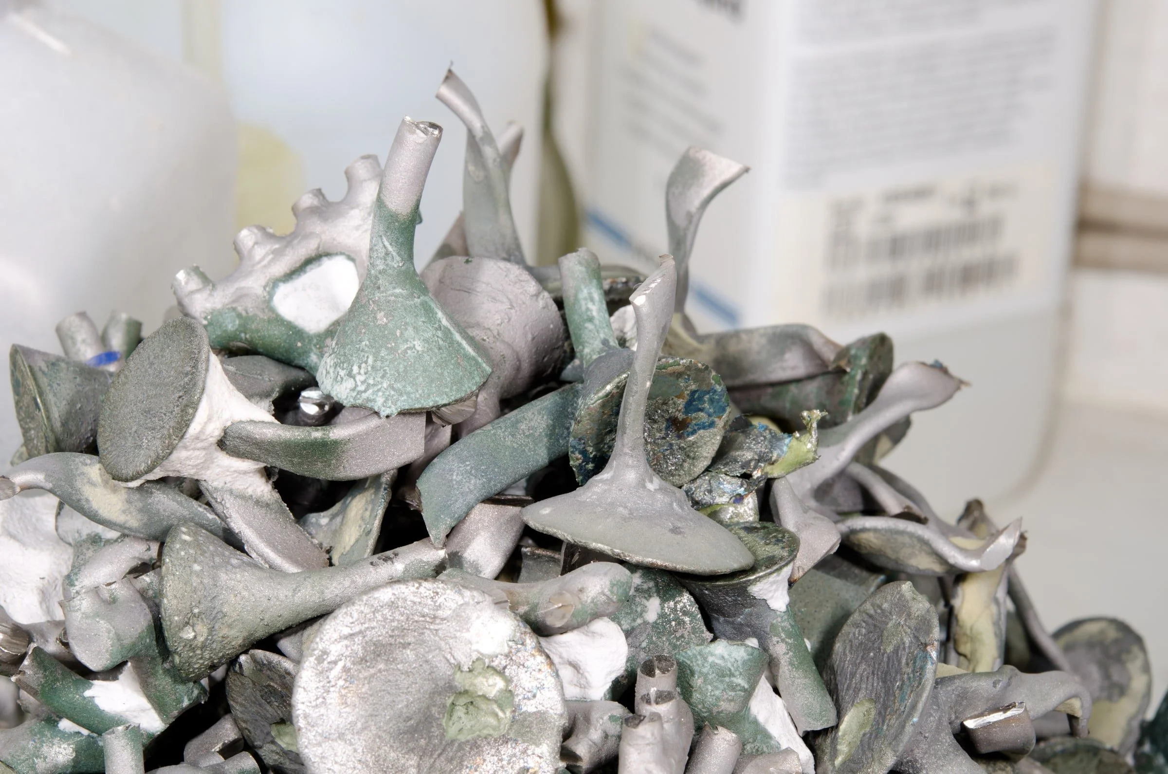Irregular metal casting remnants collected for material evaluation