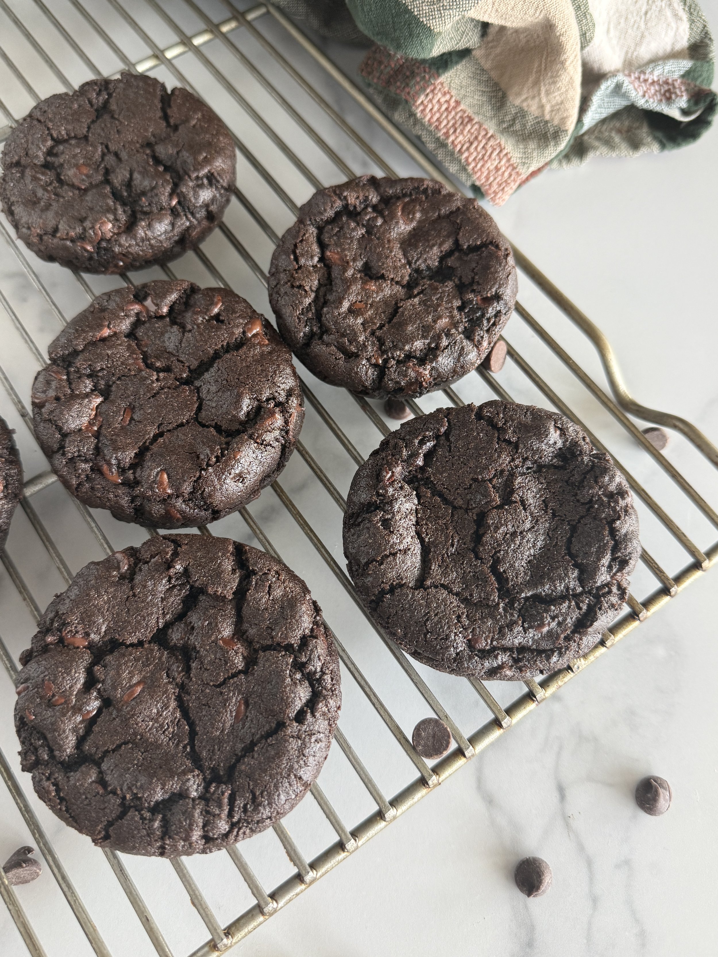 Chocolate chocolate Chip cookies on a cooling rack.