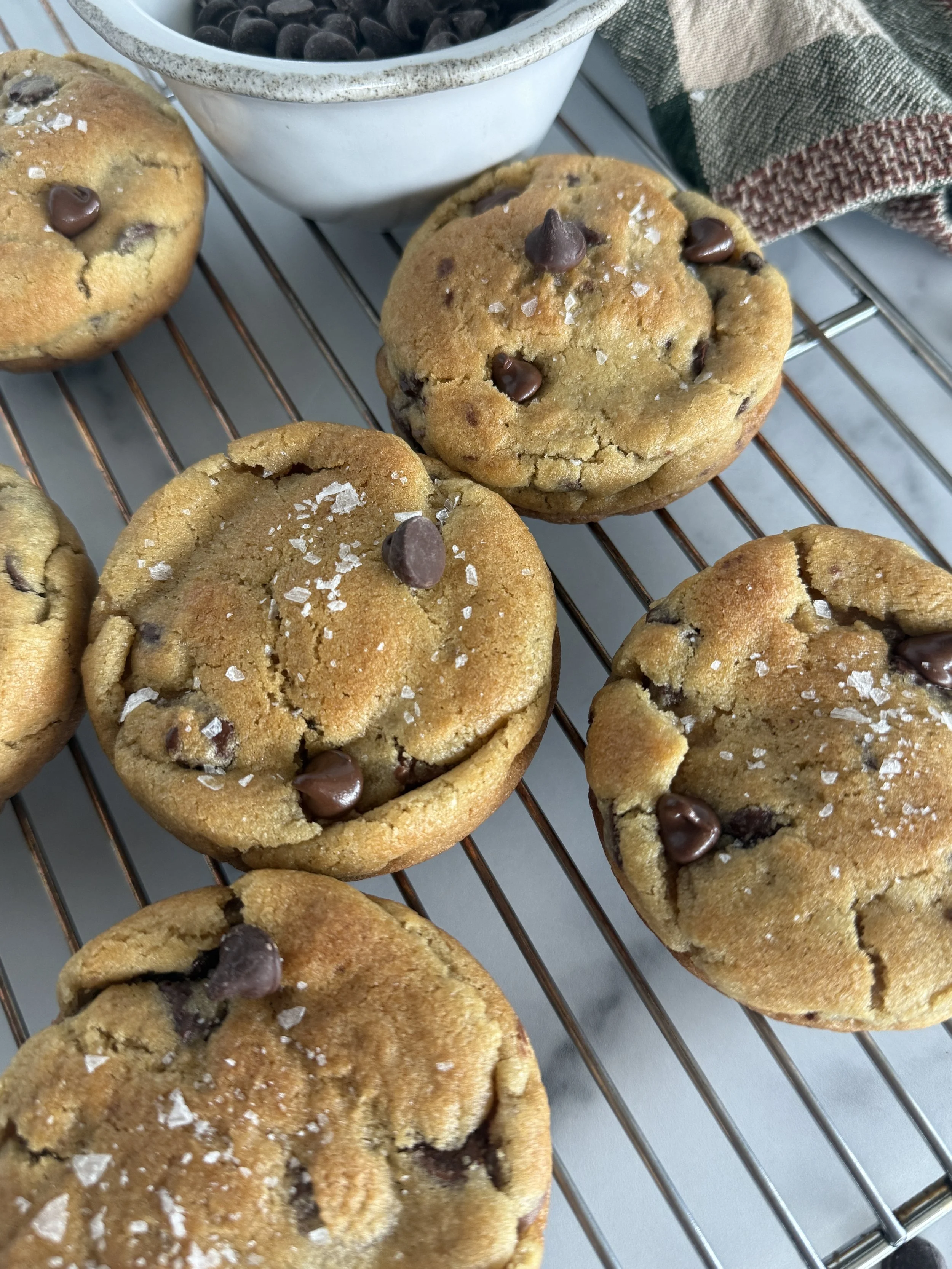 Chocolate chocolate chip cookies on a cooling rack.