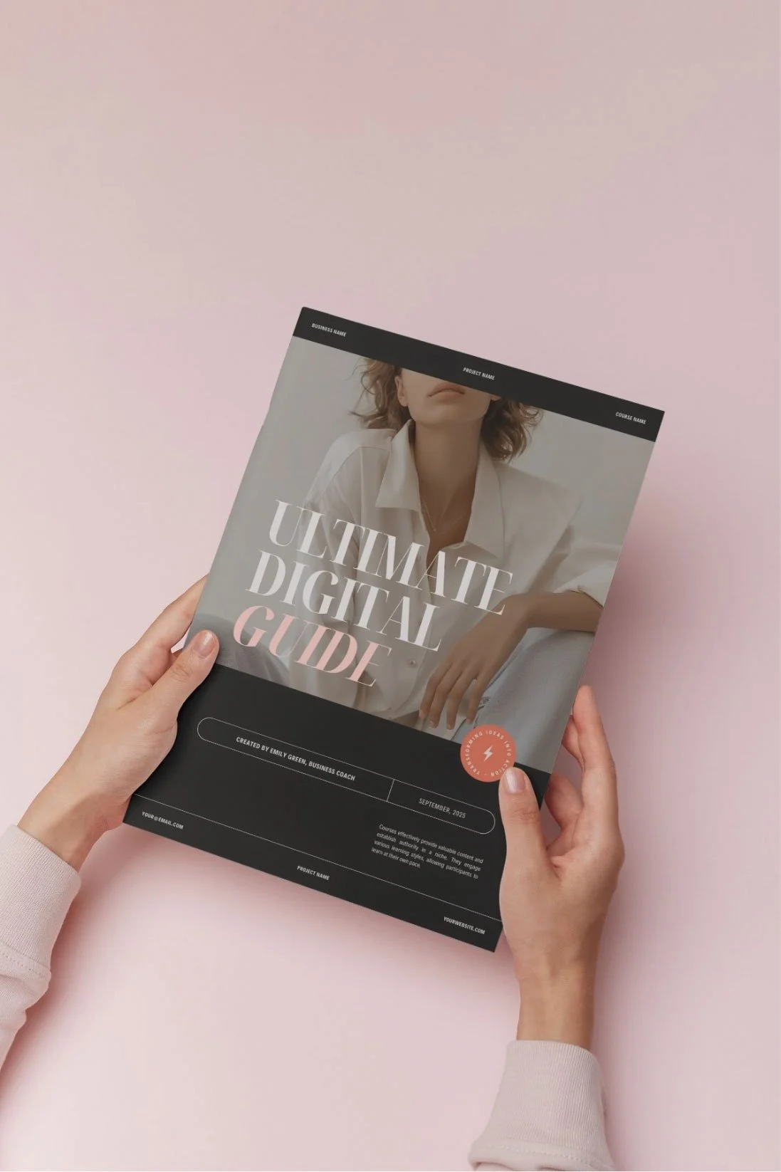 Person holding a digital course guide titled 'Ultimate Digital Guide' against a pink background.
