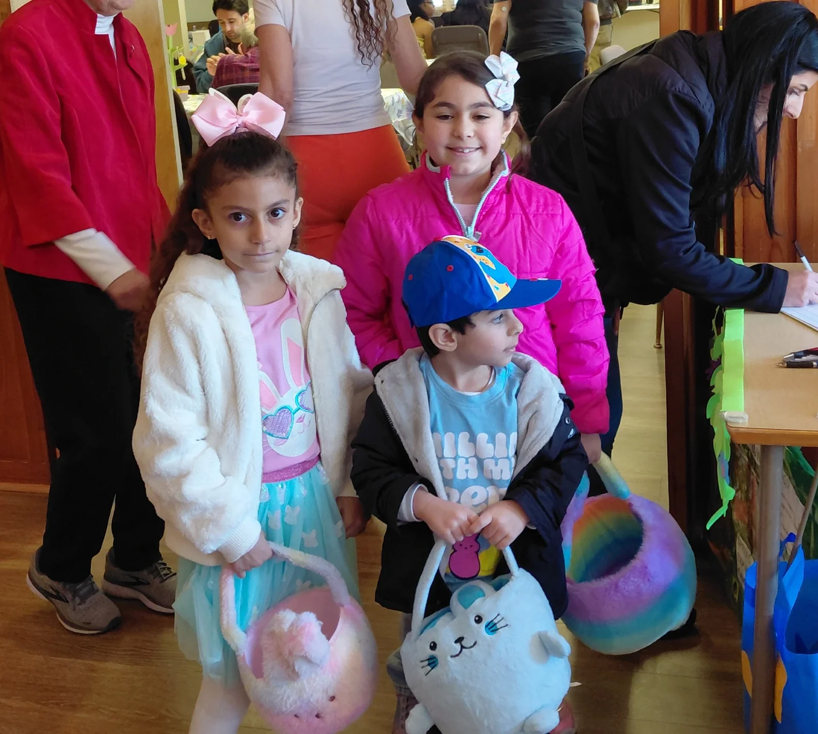 Three children with bags to collect candy