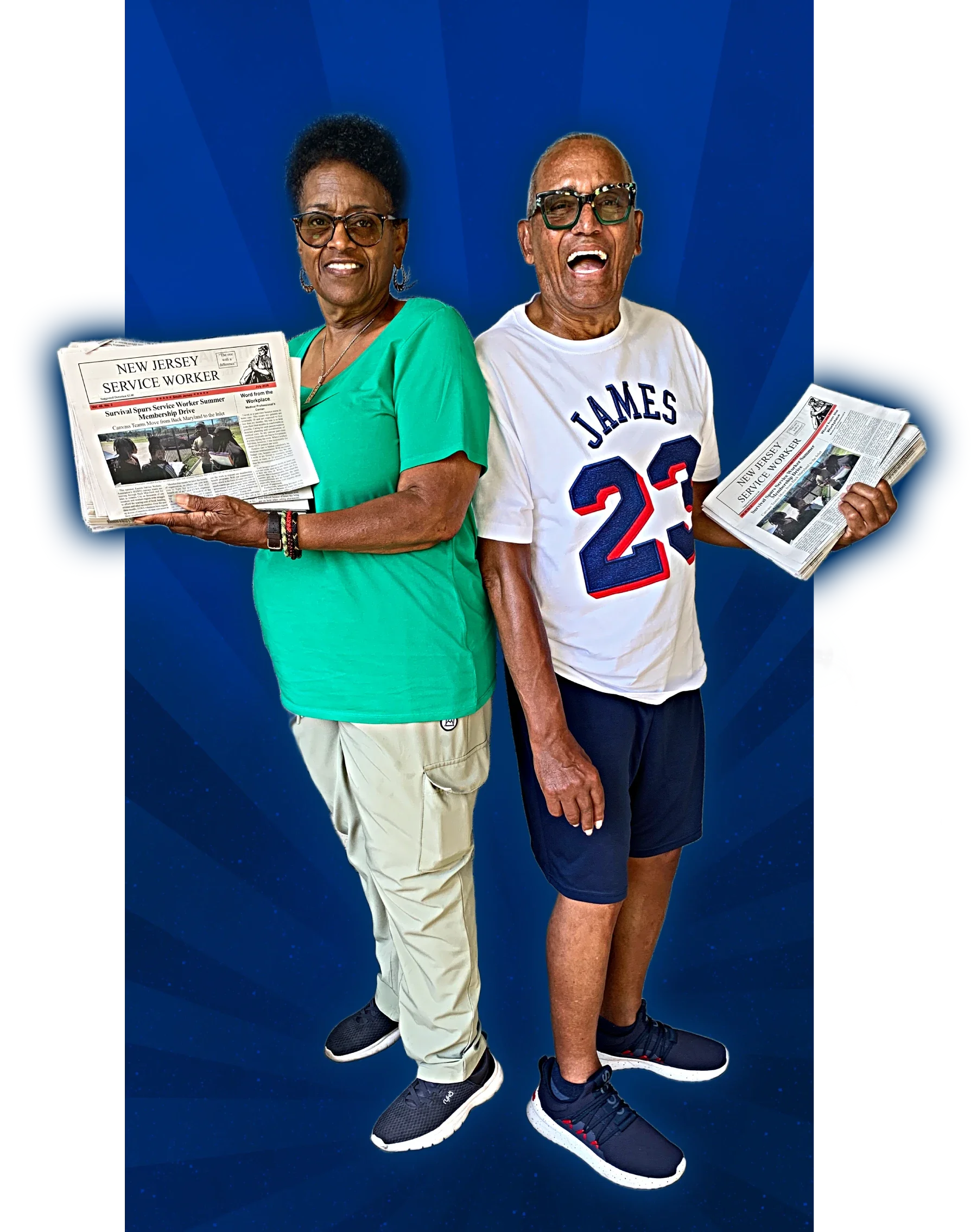 A laughing man and smiling woman hold newspapers