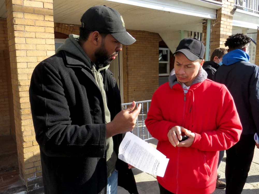 An ESWA member explaining a point to another person