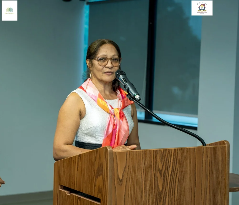 A woman speaks into a microphone