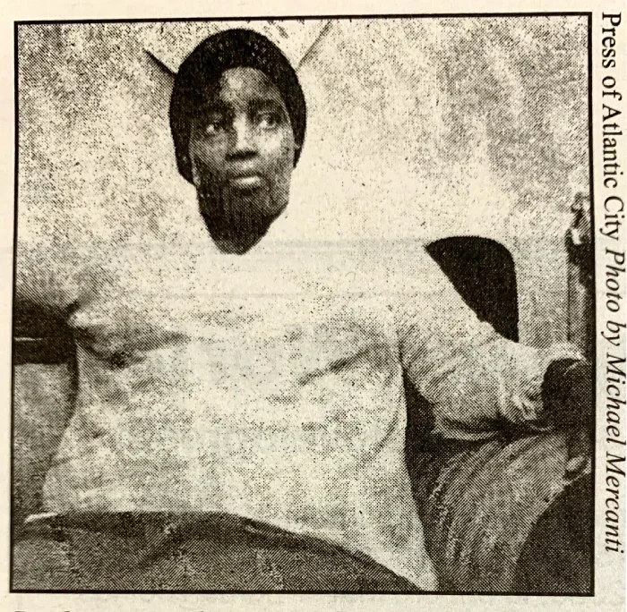 A woman sitting down on a couch