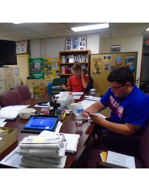 Two ESWA volunteers make phone calls