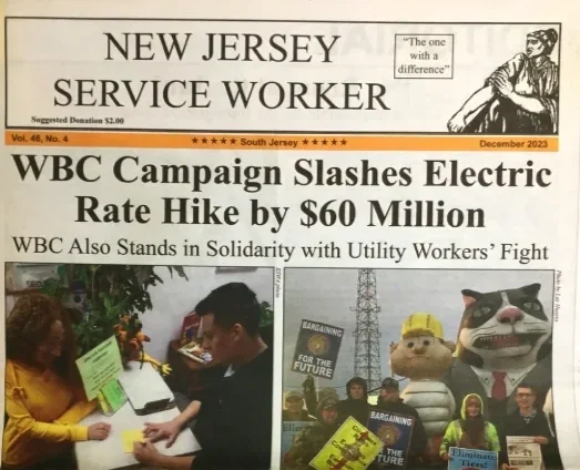 A newspaper turned to its front page announcing "WBC Campaign Slashes Electric Rate Hike by $60 Million"