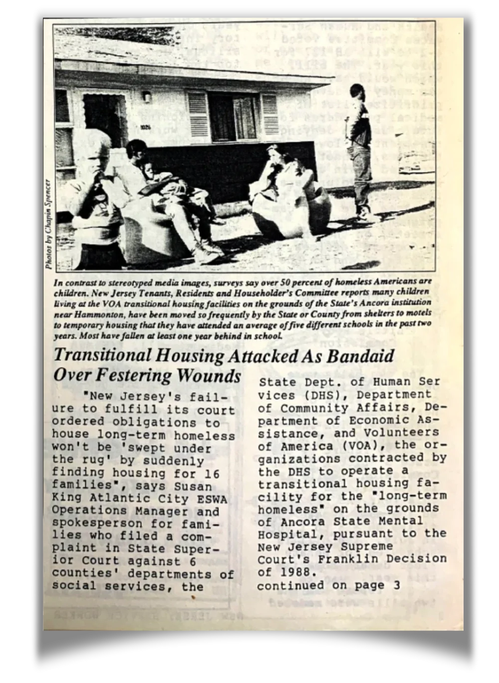 A newspaper photo with children standing in front of a motel