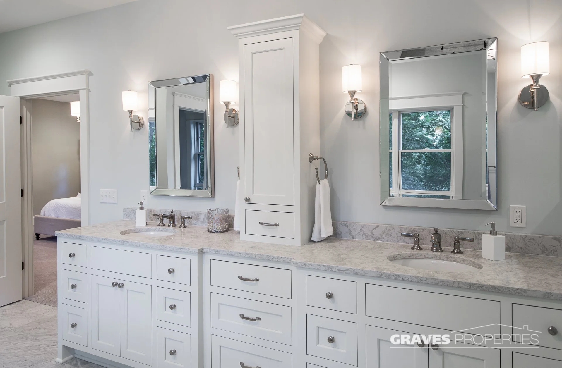 Light blue and white bathroom remodel, soaker tub, white marble shower, polished nickel hardware, Carrara marble countertops.