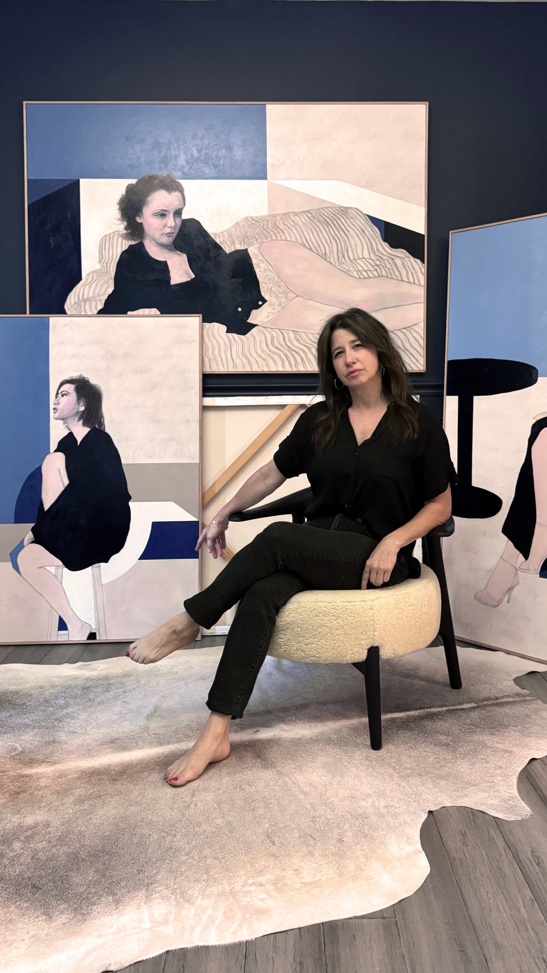 Artist Shannon Boutilier in her studio with paintings from The Goddess Series.