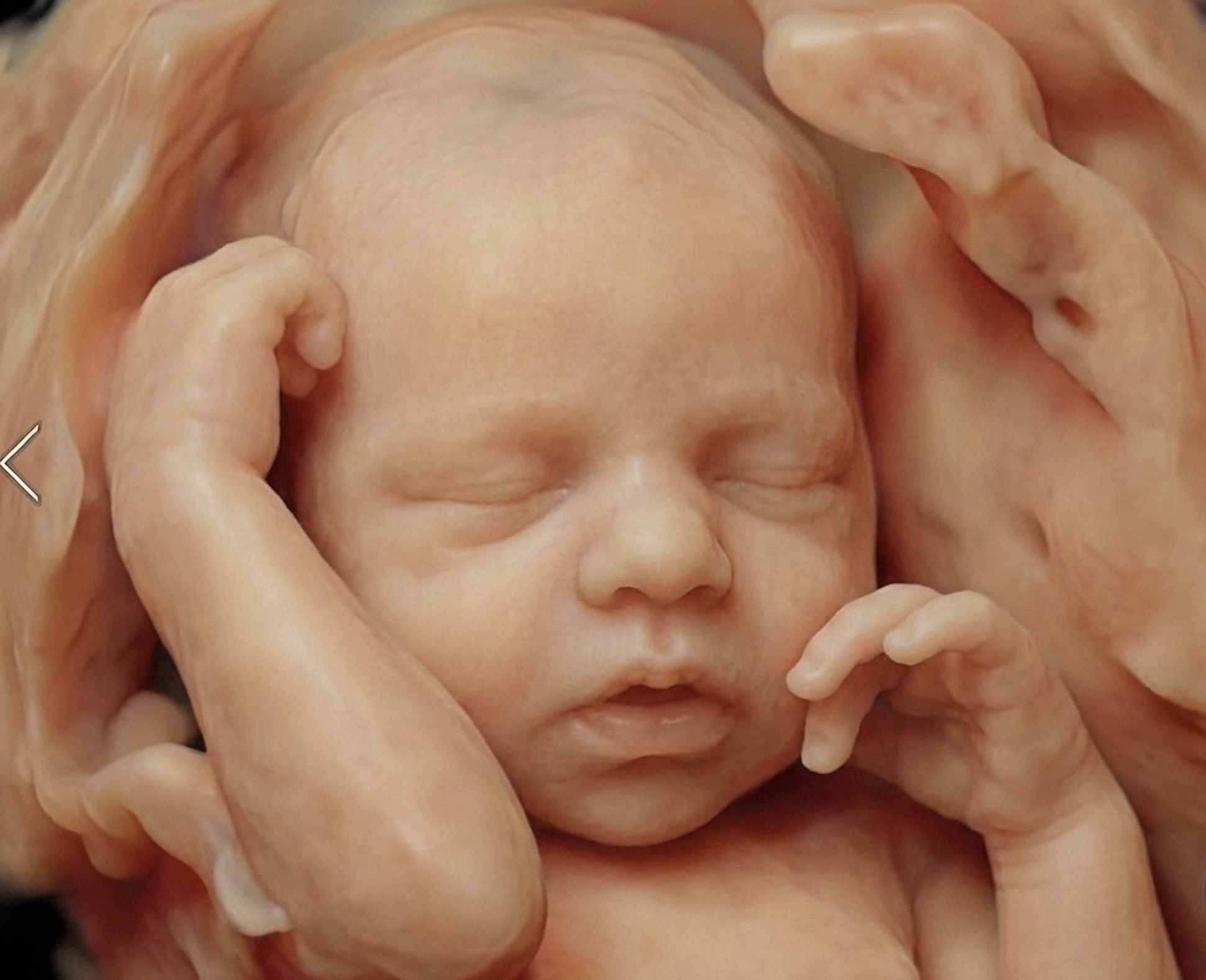 Close-up of a doll's face with hands covering its eyes, orange and peach tones, detailed facial features.