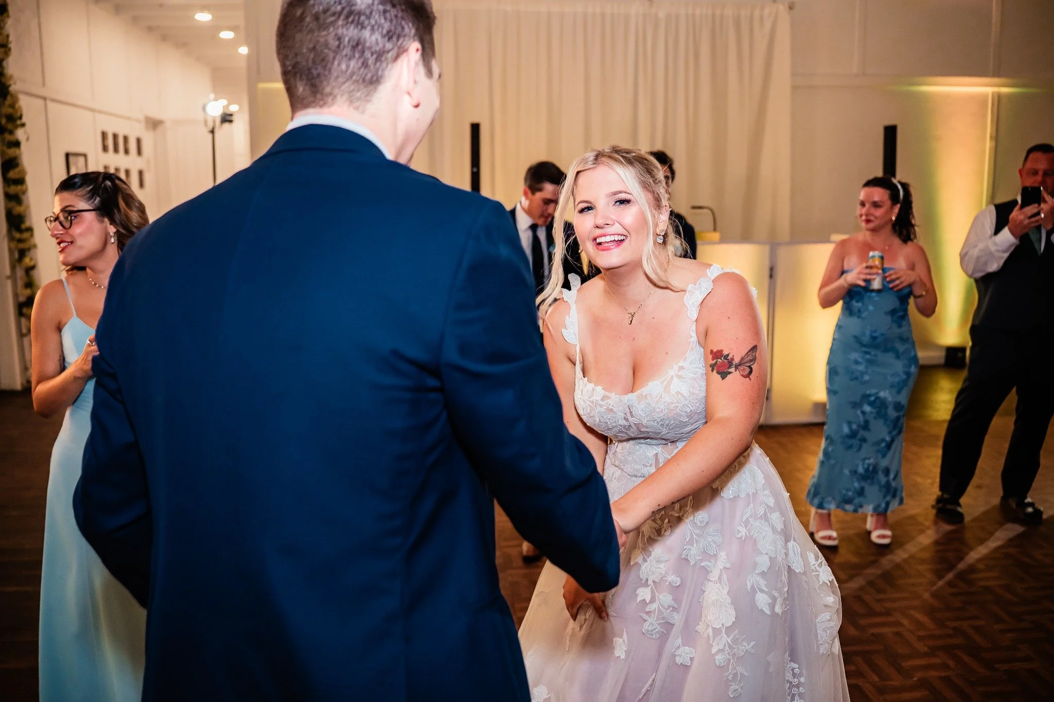bride-smiling-on-dance-floor-ever-after-farms-flower-barn-vowscout.jpg