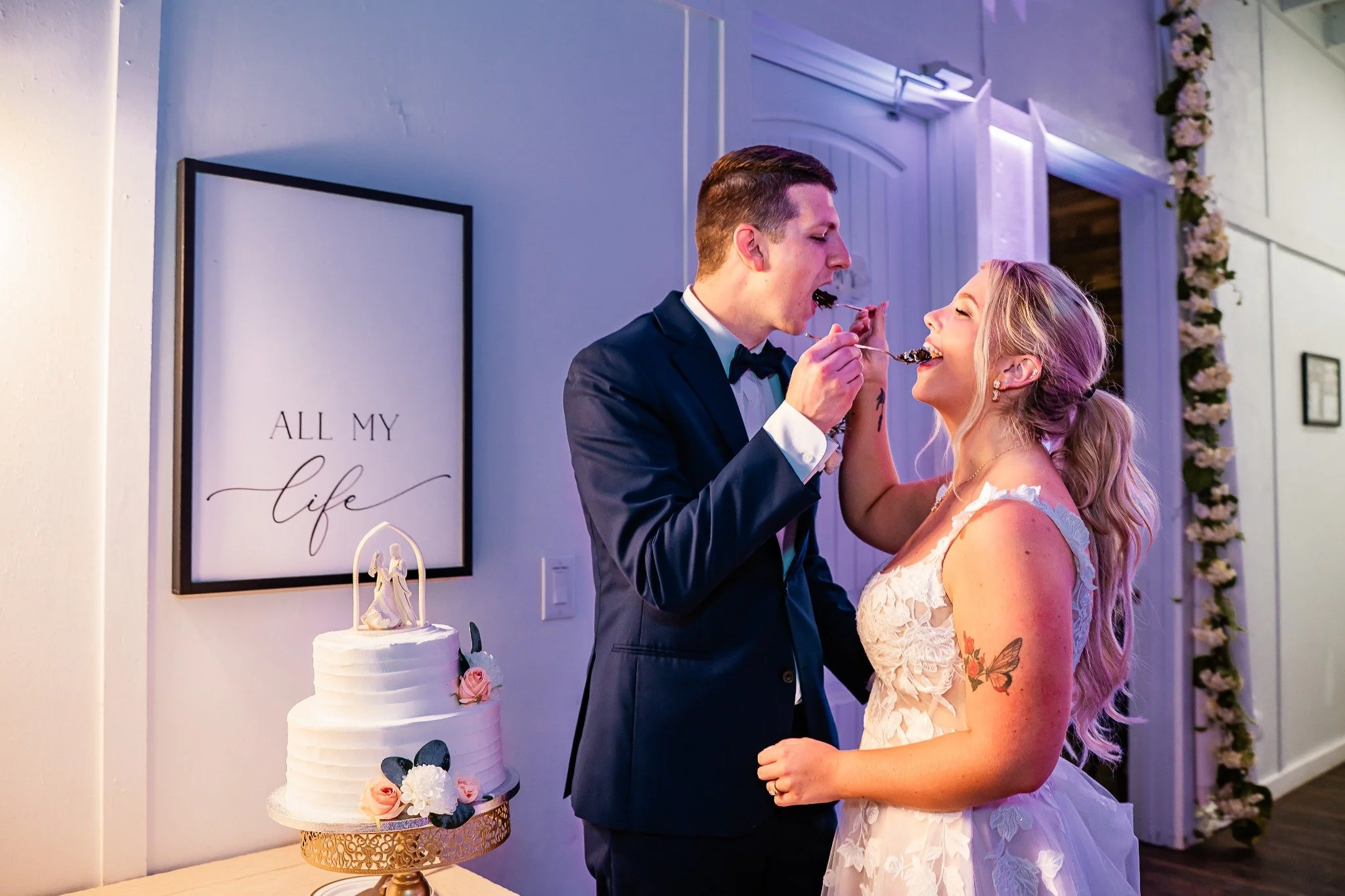 bride-and-groom-cake-cutting-ever-after-farms-flower-barn-vowscout.jpg