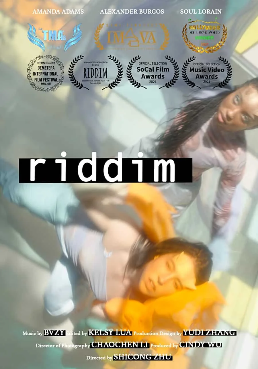 A poster for the film "Riddim" featuring two women in a blurred background, with various film festival awards and nominations displayed, including the Demeter International Film Festival and SoCal Film Awards.