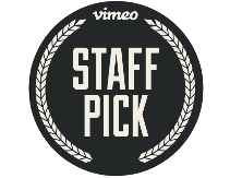 A circular badge with a black background and white text that reads 'Vimeo STAFF PICK,' surrounded by a laurel wreath design.