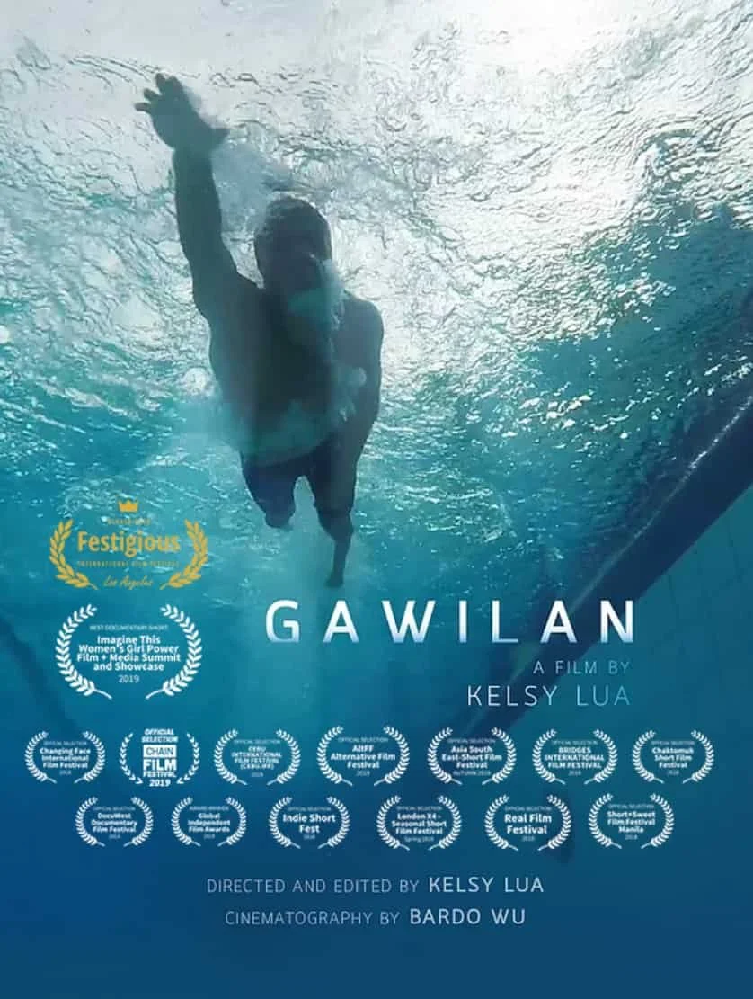 Underwater scene with a man swimming towards the camera. Movie poster for 'Gawilan' by Kelsy Lua, featuring awards and film festival logos.