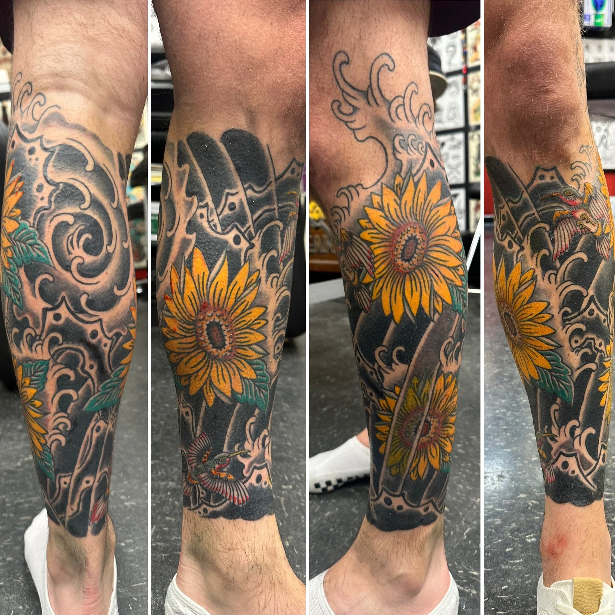 A close-up of a person's arm and leg tattoos. The tattoos feature colorful floral designs, waves, and koi fish, with some sections showing black and grey shading.
