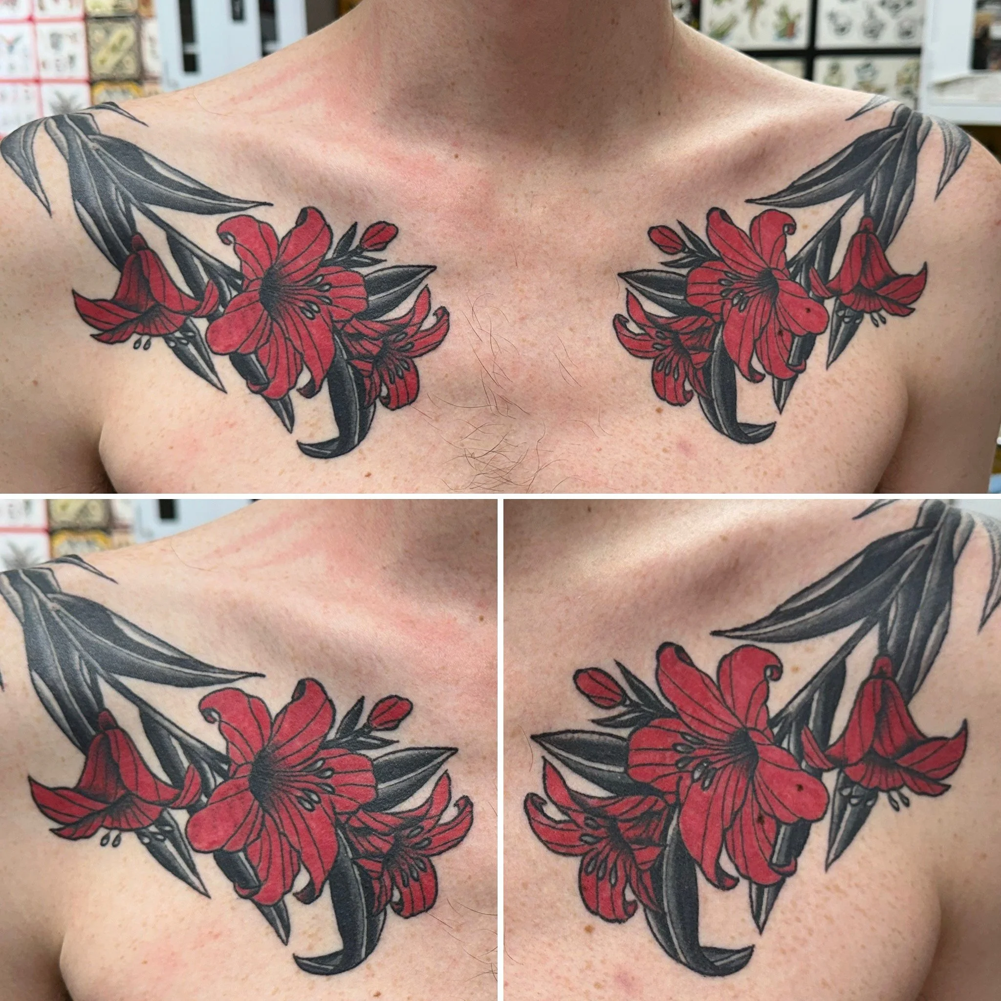 A person's upper chest and shoulders with a tattoo of large red flowers and black leaves extending across both shoulders.