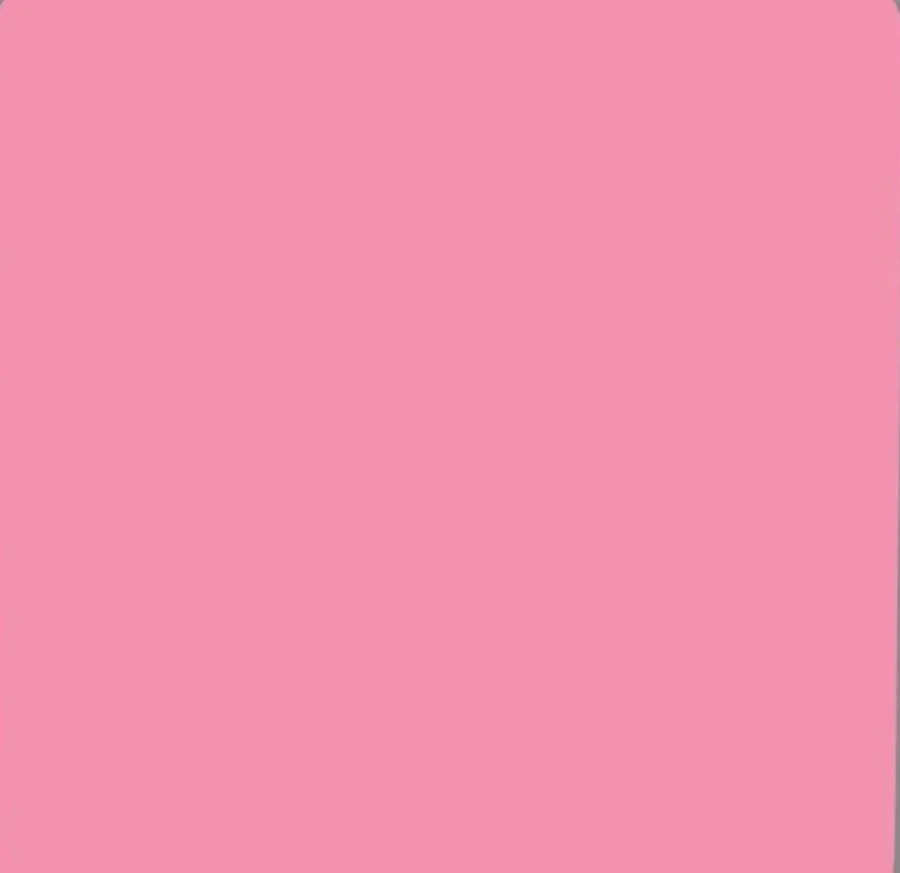 A solid pink background with no visible objects or details.