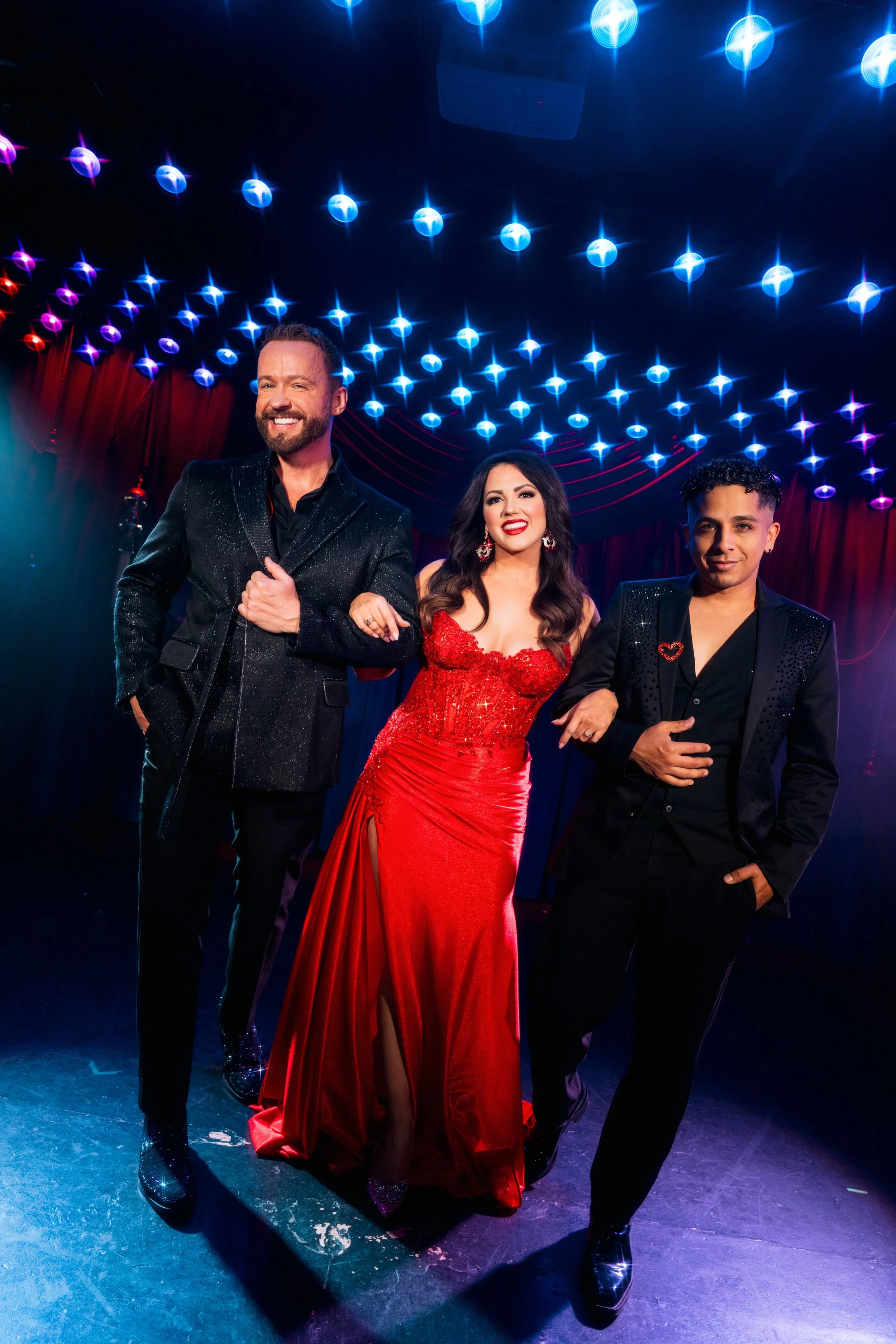 Triple Threat (trio vocal group) consisting of Marty Thomas, Rachel Potter, and Omar Cardona.