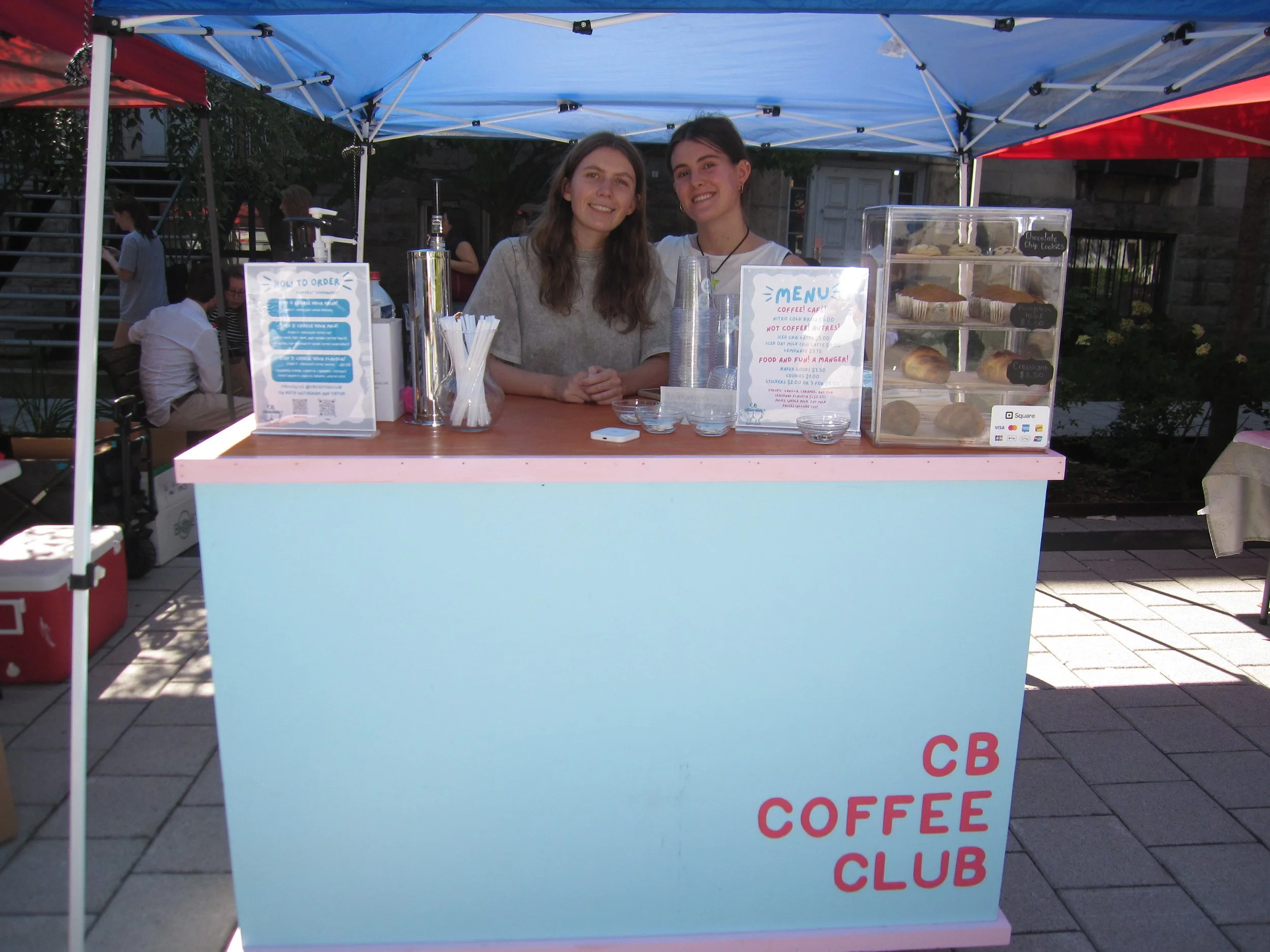 young female entrepreneurs at their coffee cart