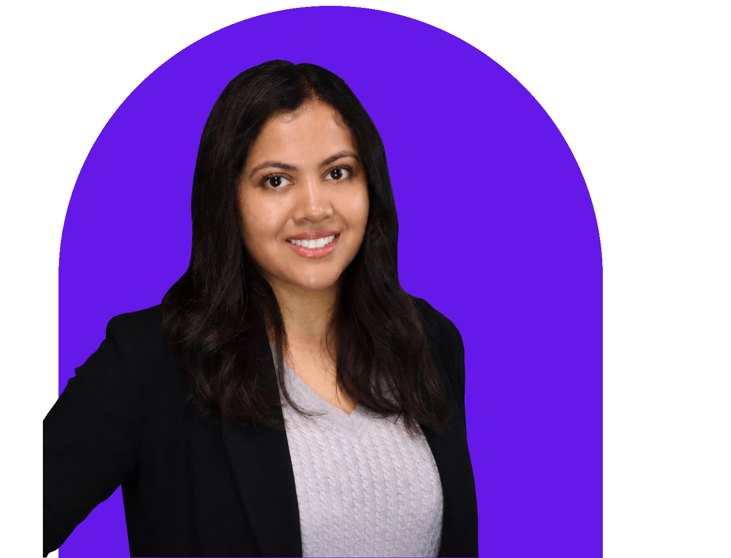 A woman with long dark hair, wearing a black blazer and a light grey sweater, smiling at the camera, with a purple background.