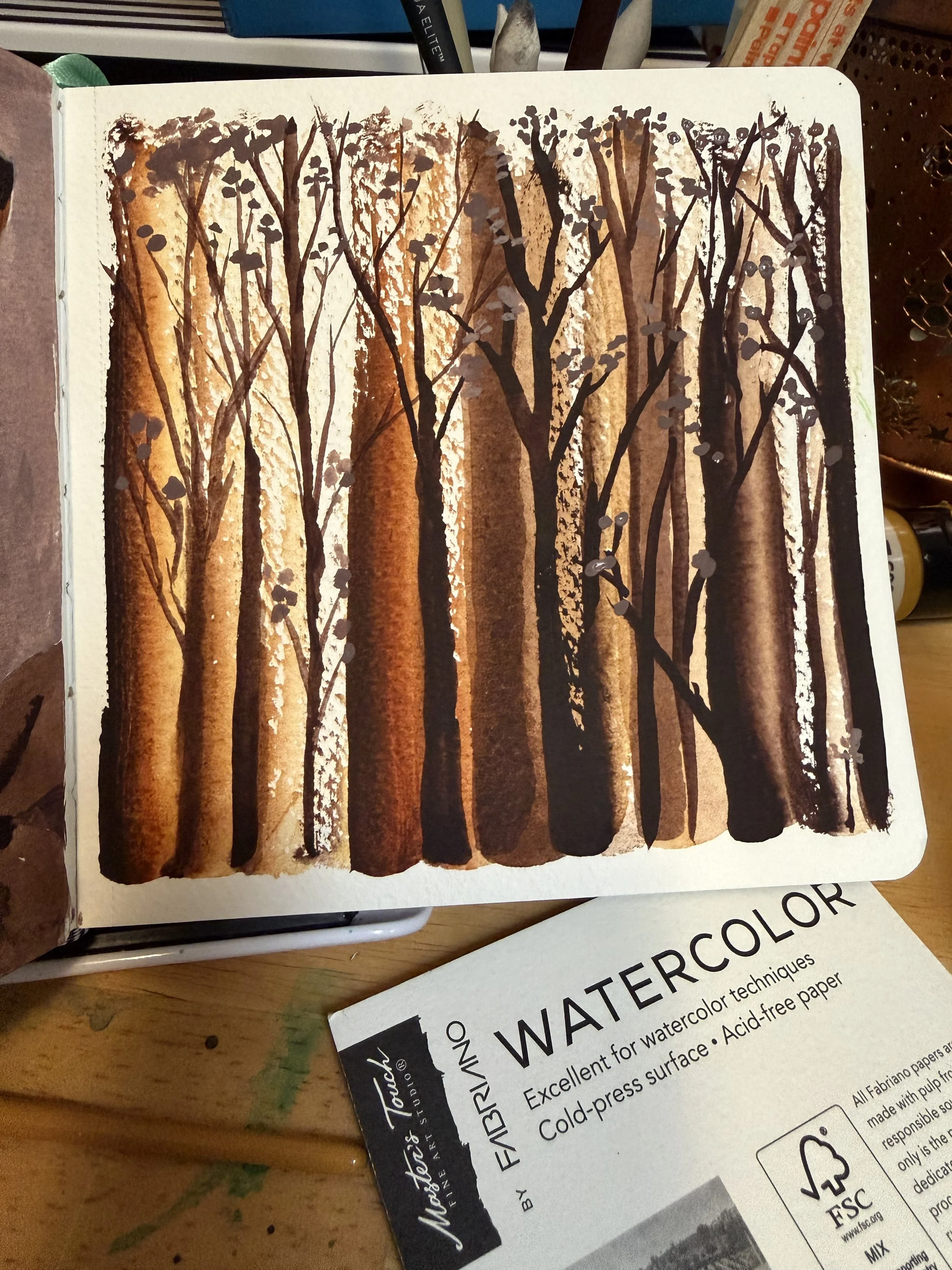 A sketch of a forest scene with tall trees and branches, created with watercolor technique using brown and black watercolor.