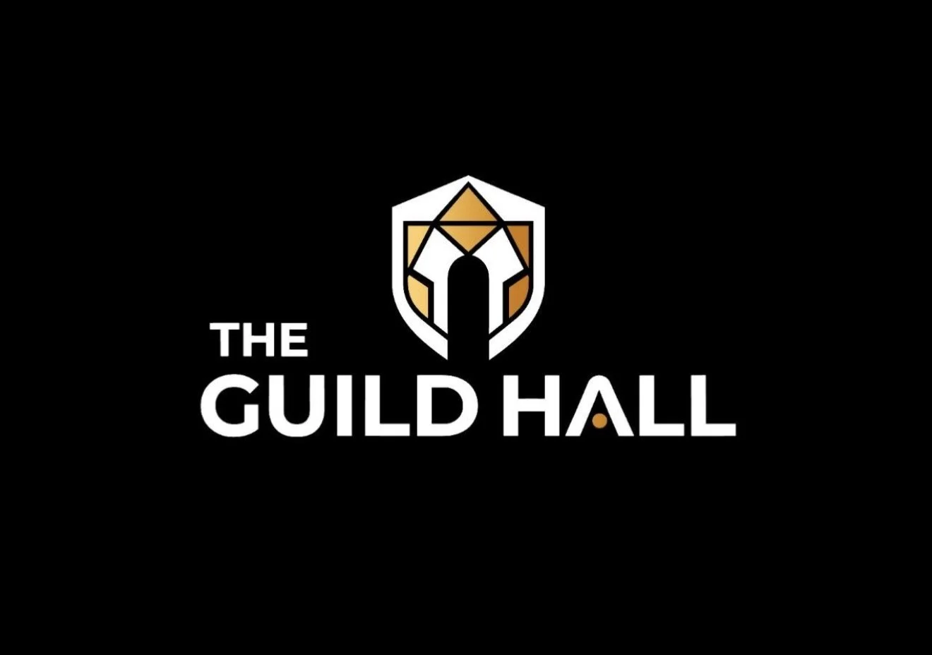 Logo for The Guild Hall featuring a stylized shield crest with gold, black, and white details, and the text 'The Guild Hall' in bold white letters on a black background.