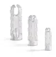 Three white plastic bottles of different heights on a plain background